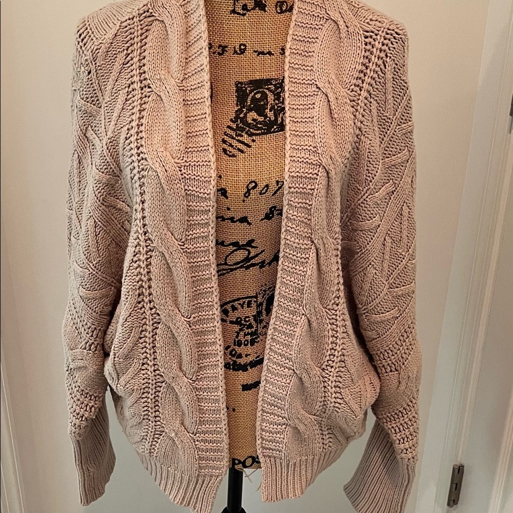 Draped tan long sleeved open front sweater.